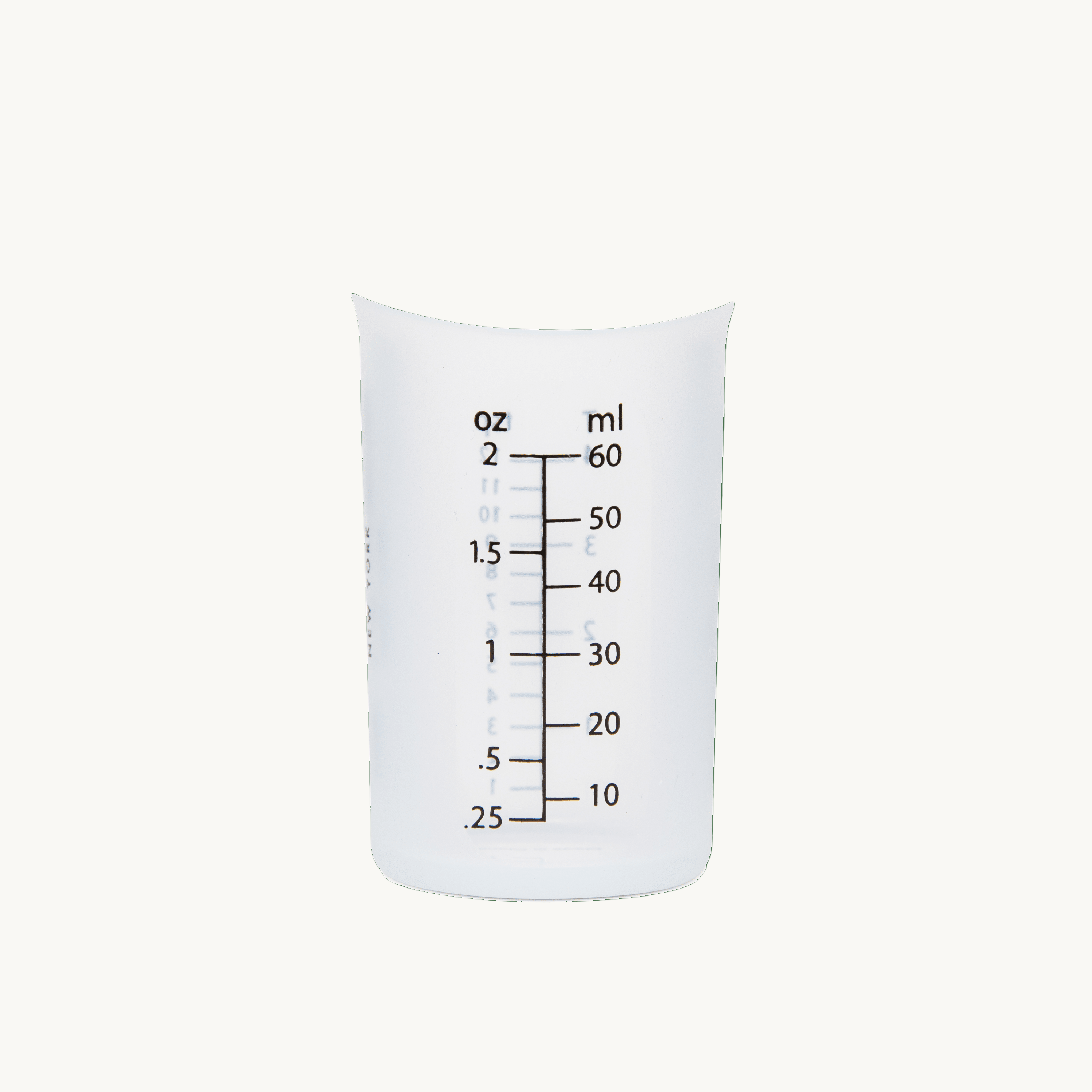 The Laundress Laundry Measuring Cup, a reusable silicone cup for doing The Laundress fabric care solutions.