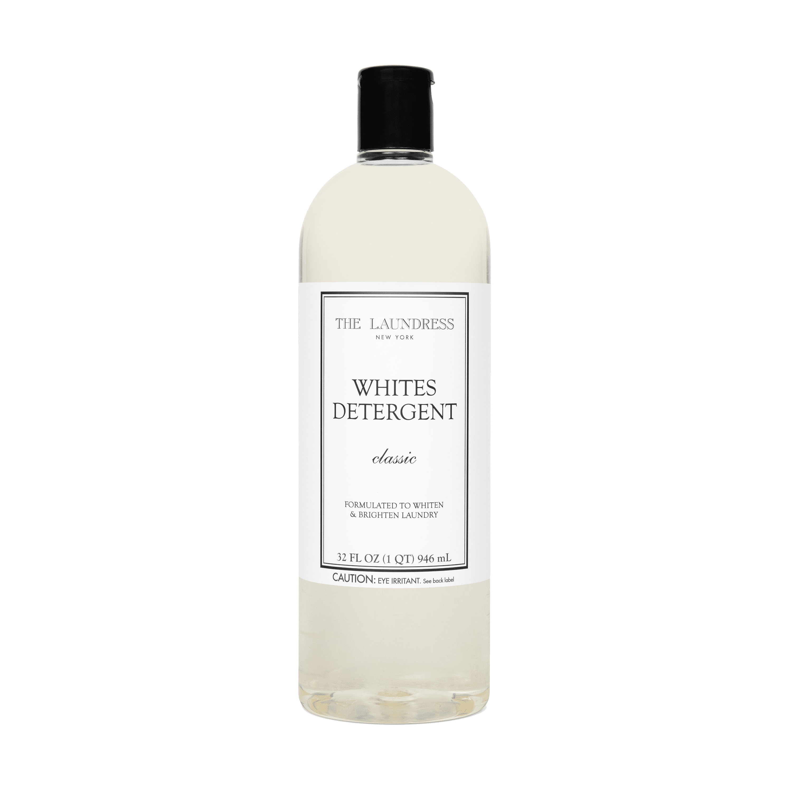 The Laundress Whites Detergent formulated to whiten & brighten laundry laying in water with white fabric.