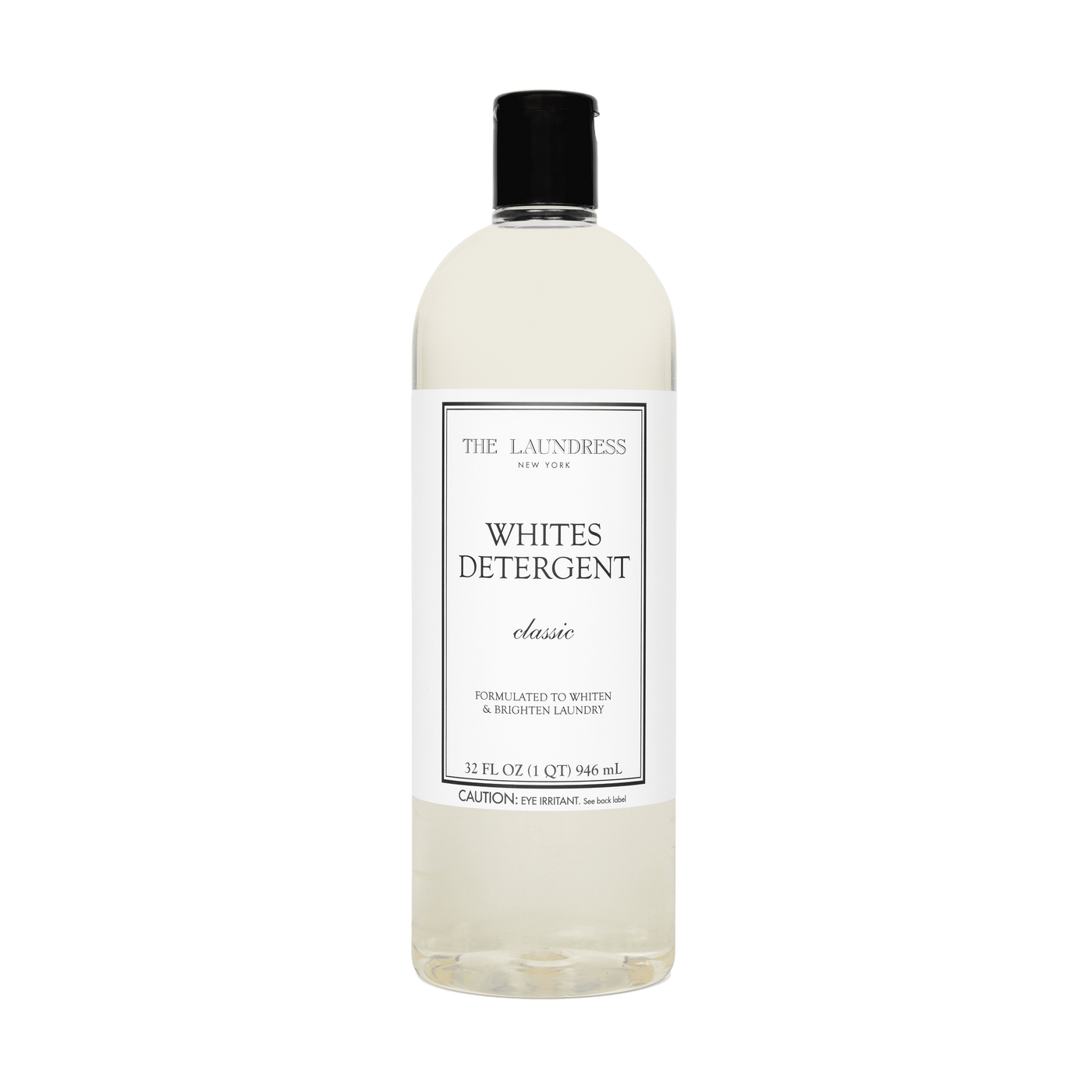 The Laundress Whites Detergent formulated to whiten & brighten laundry laying in water with white fabric.